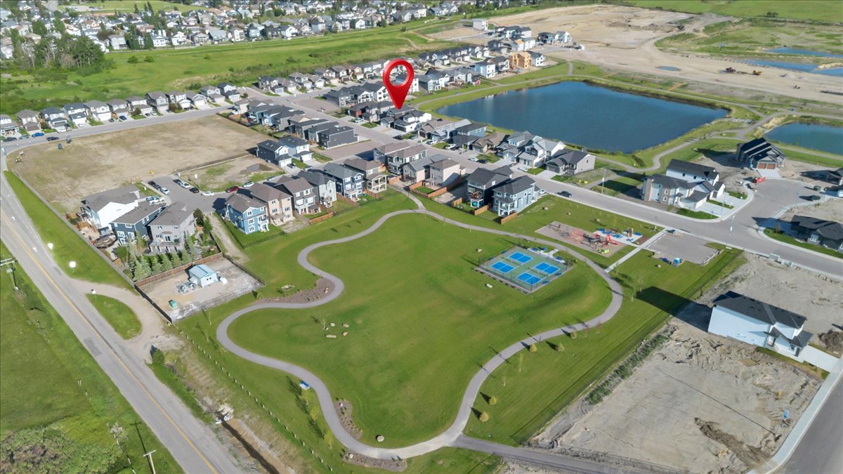 Lakewood community pathway and pond in Strathmore