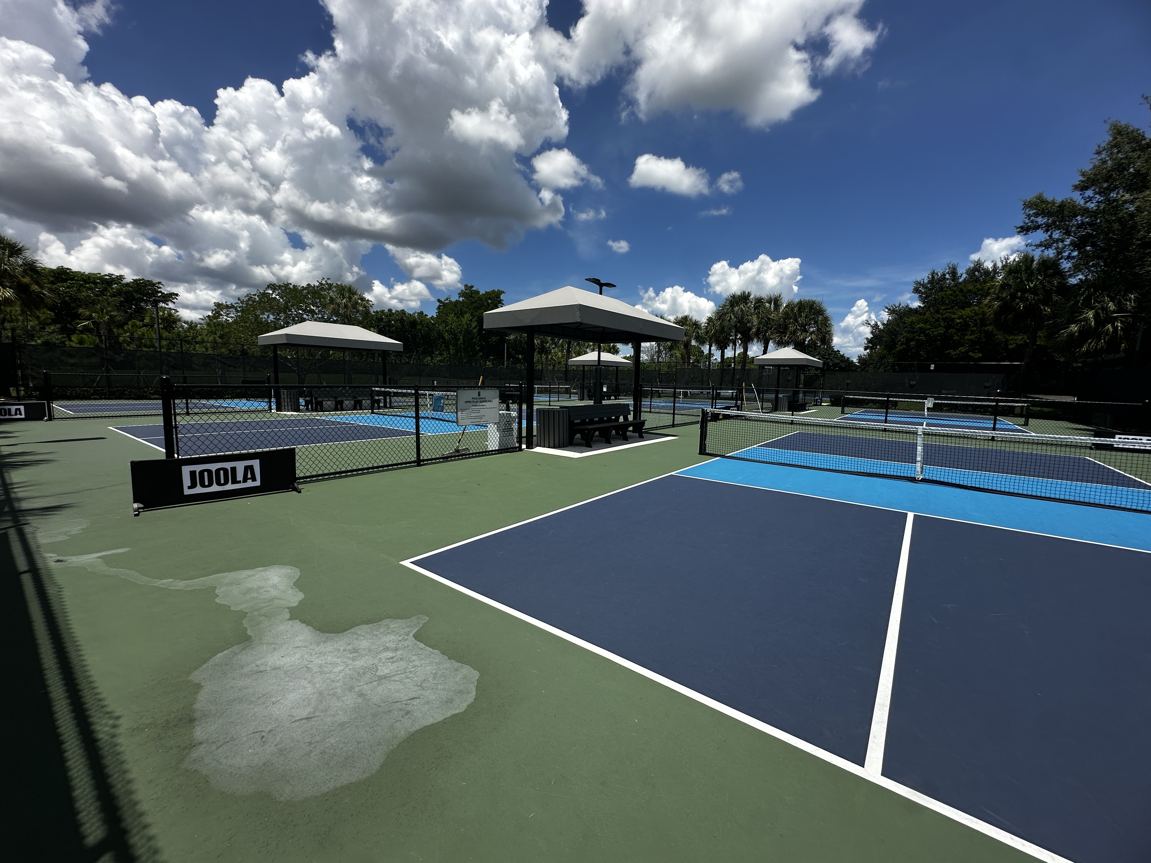 Pickleball courts and shaded pavilions at The Commons in Heron Bay, Coral Springs, Florida