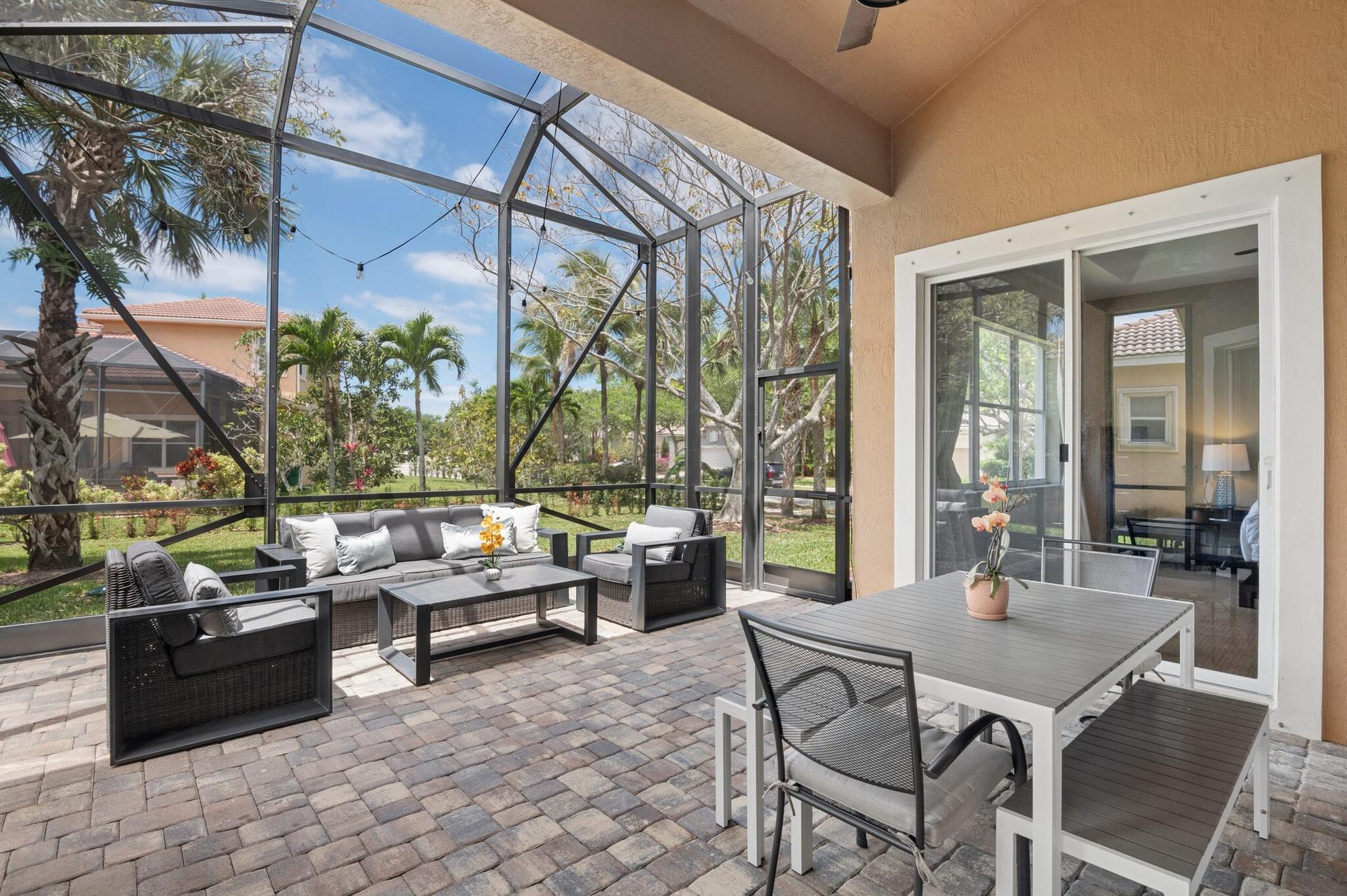 Screened outdoor living area at a Heron Cove home in Heron Bay, Parkland, Florida