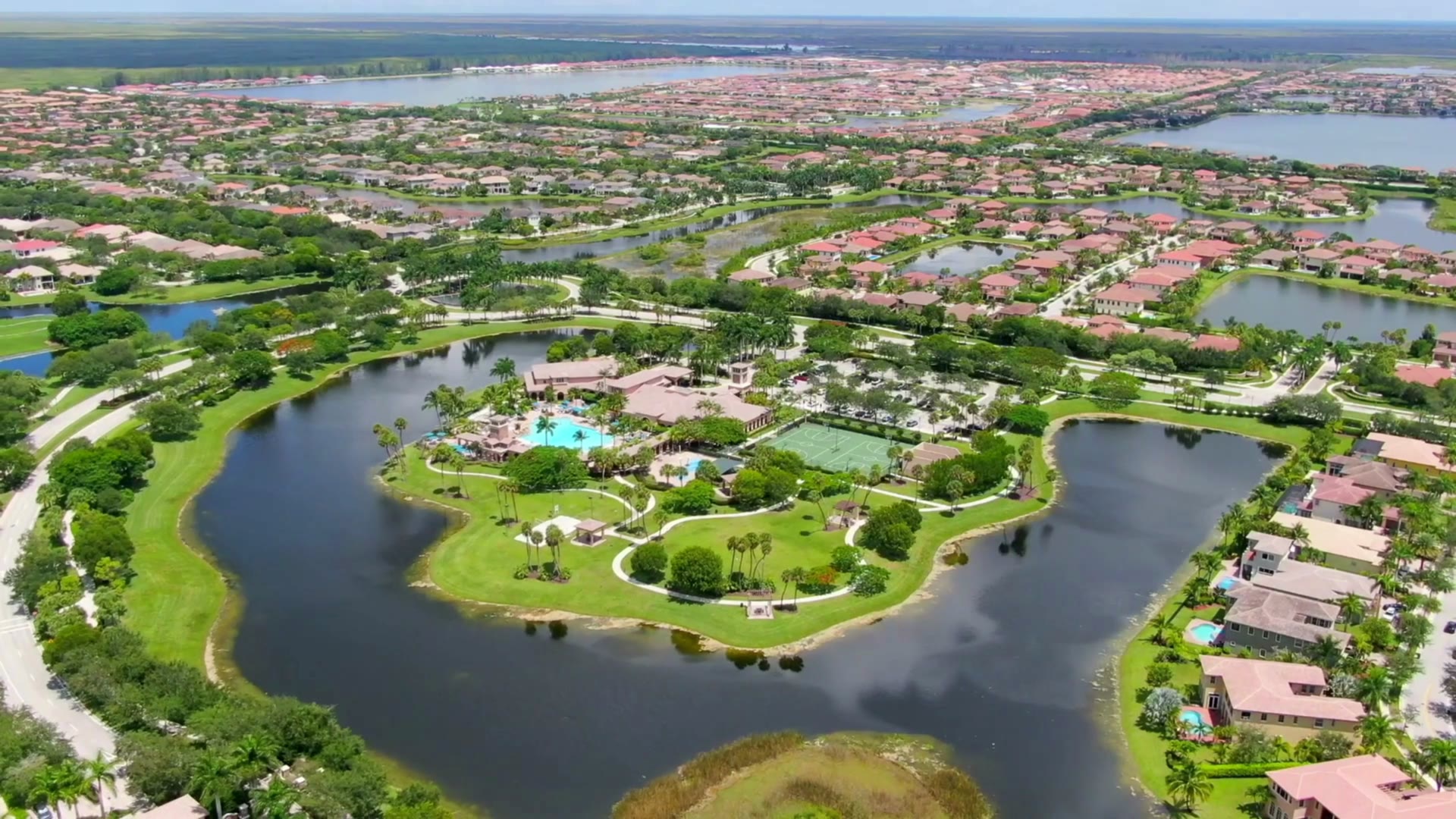 Plaza del Lago pool, courts and amenity grounds in Heron Bay