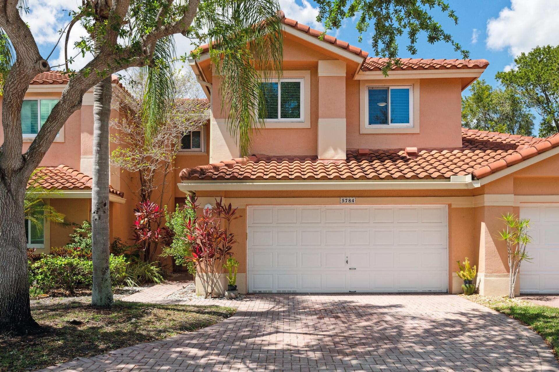Home and landscaped streetscape in the Fairways at Heron Bay