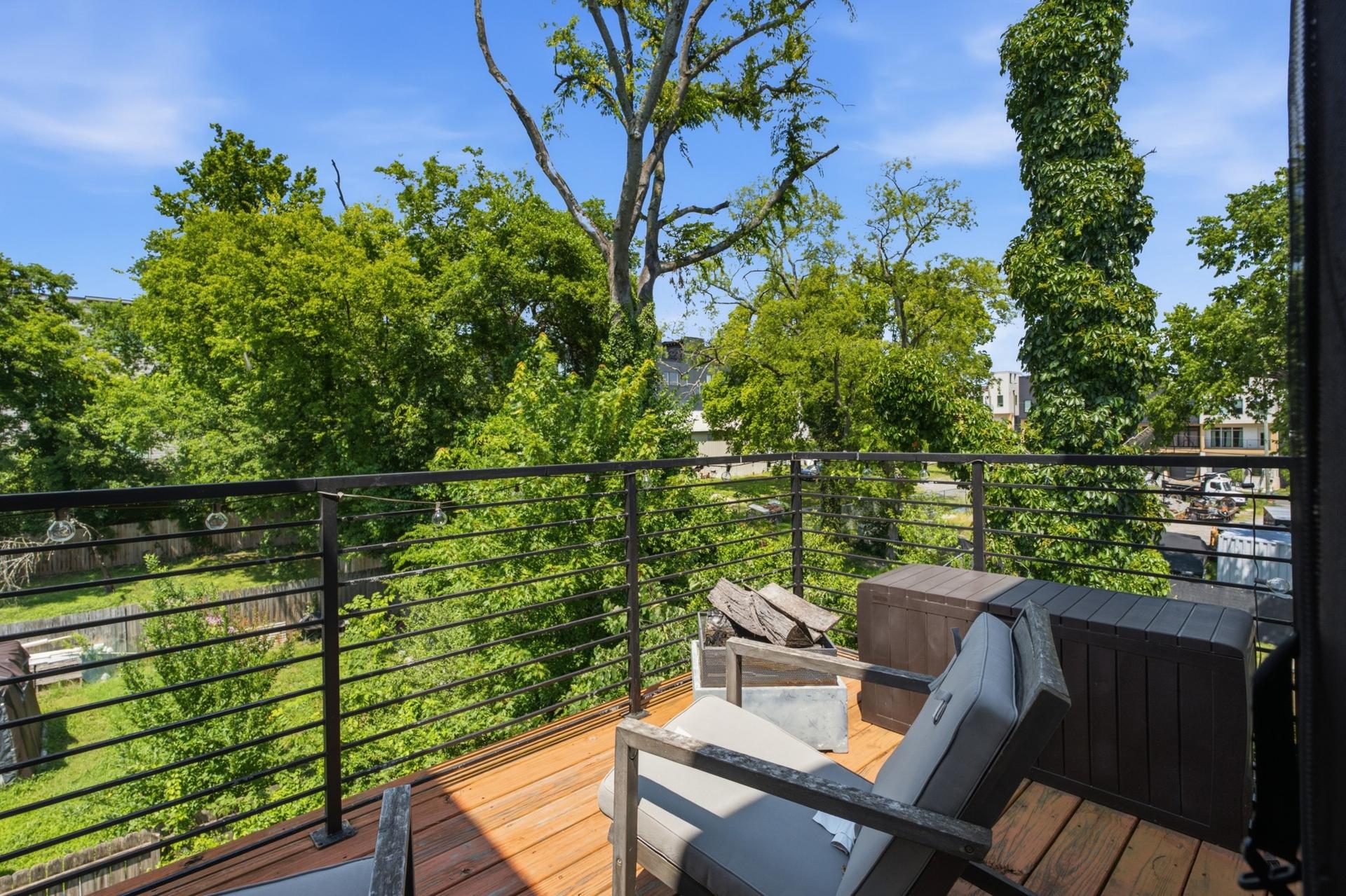 Private balcony with tree-lined view