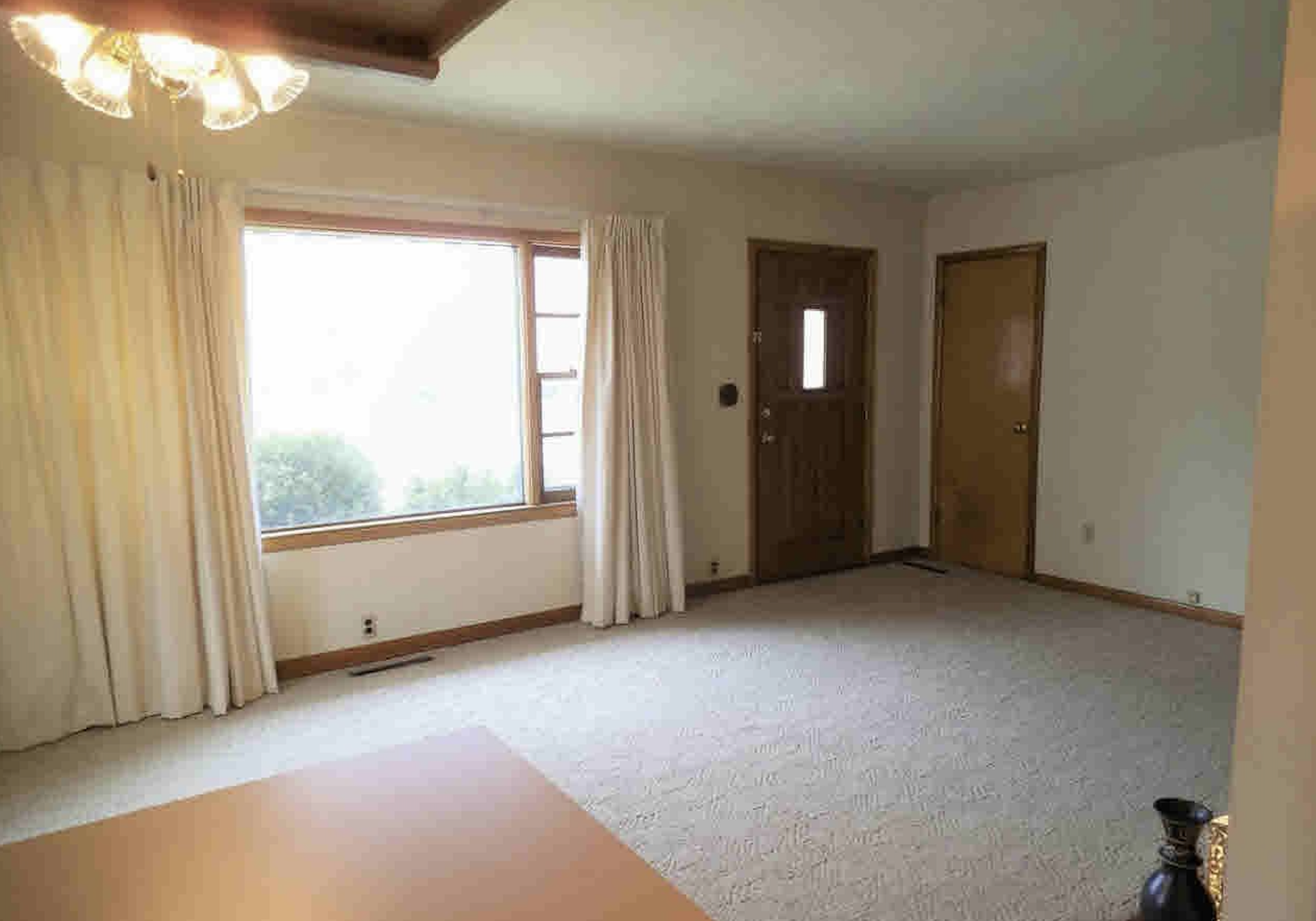 Empty living room before full-service home staging